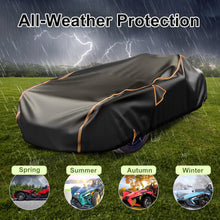 Load image into Gallery viewer, Black car cover with orange trim on a grassy field with weather effects, labeled 'All-Weather Protection'.