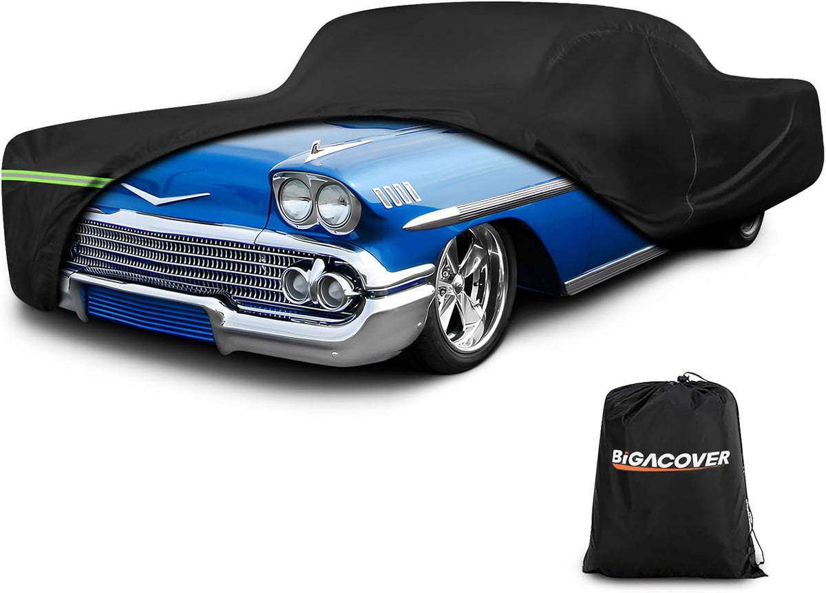 Black car cover on a blue classic car with Bigacover branding.

