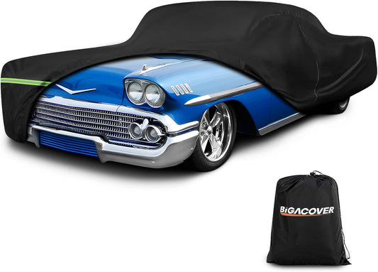 Black car cover on a blue classic car with Bigacover branding.

