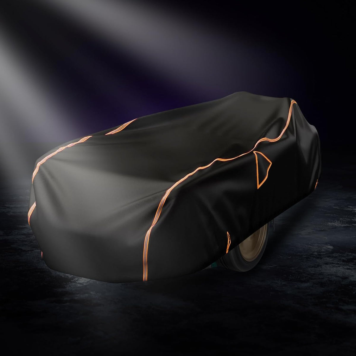 Black car cover with orange stitching on a dark background