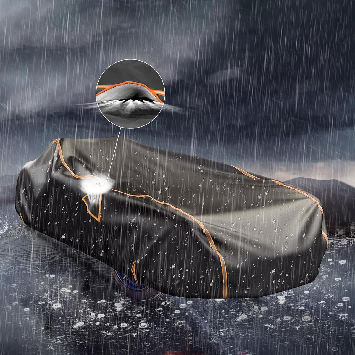 Car cover protecting a car from rain with a mountain background