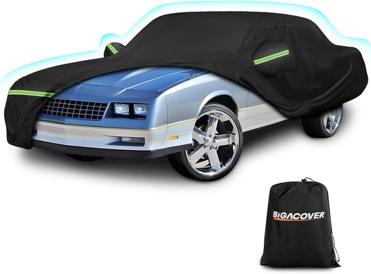 Car covered with a black car cover and Bigacover bag on a white background


