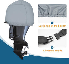 Load image into Gallery viewer, Close-up of a boat motor cover showing the elastic hem and adjustable quick-release buckle for a secure, custom fit on outboard engines.
