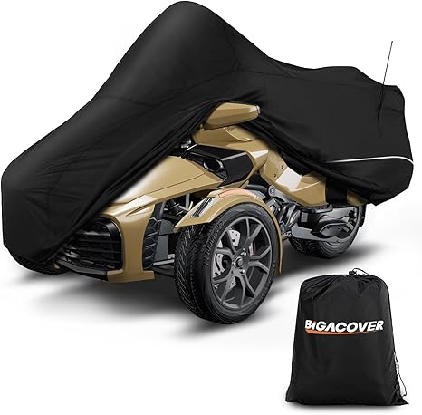 Gold ATV covered with a black cover and Bigacover bag on a white background